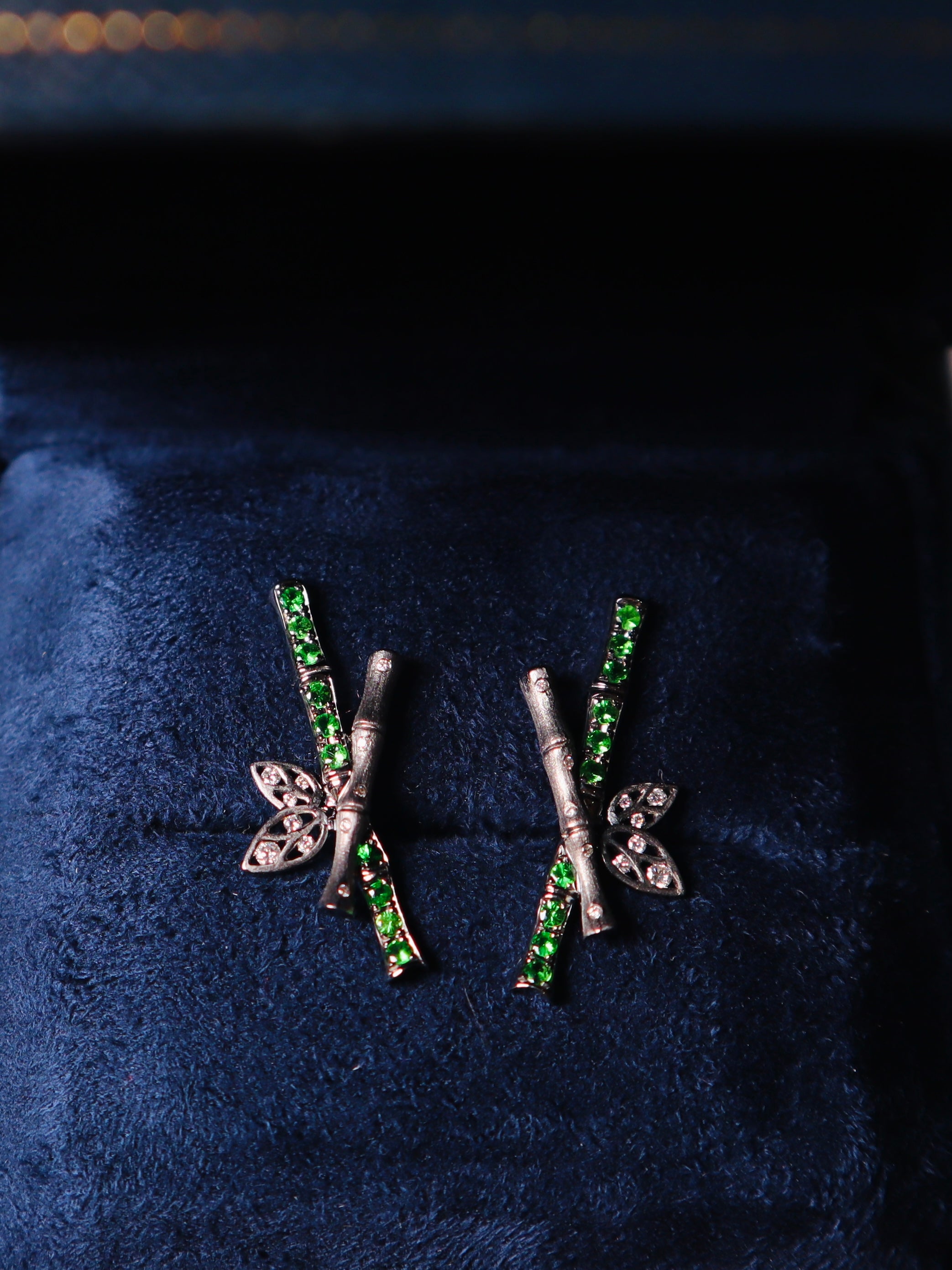 Tsavorite bamboo earrings on midnight blue velvet